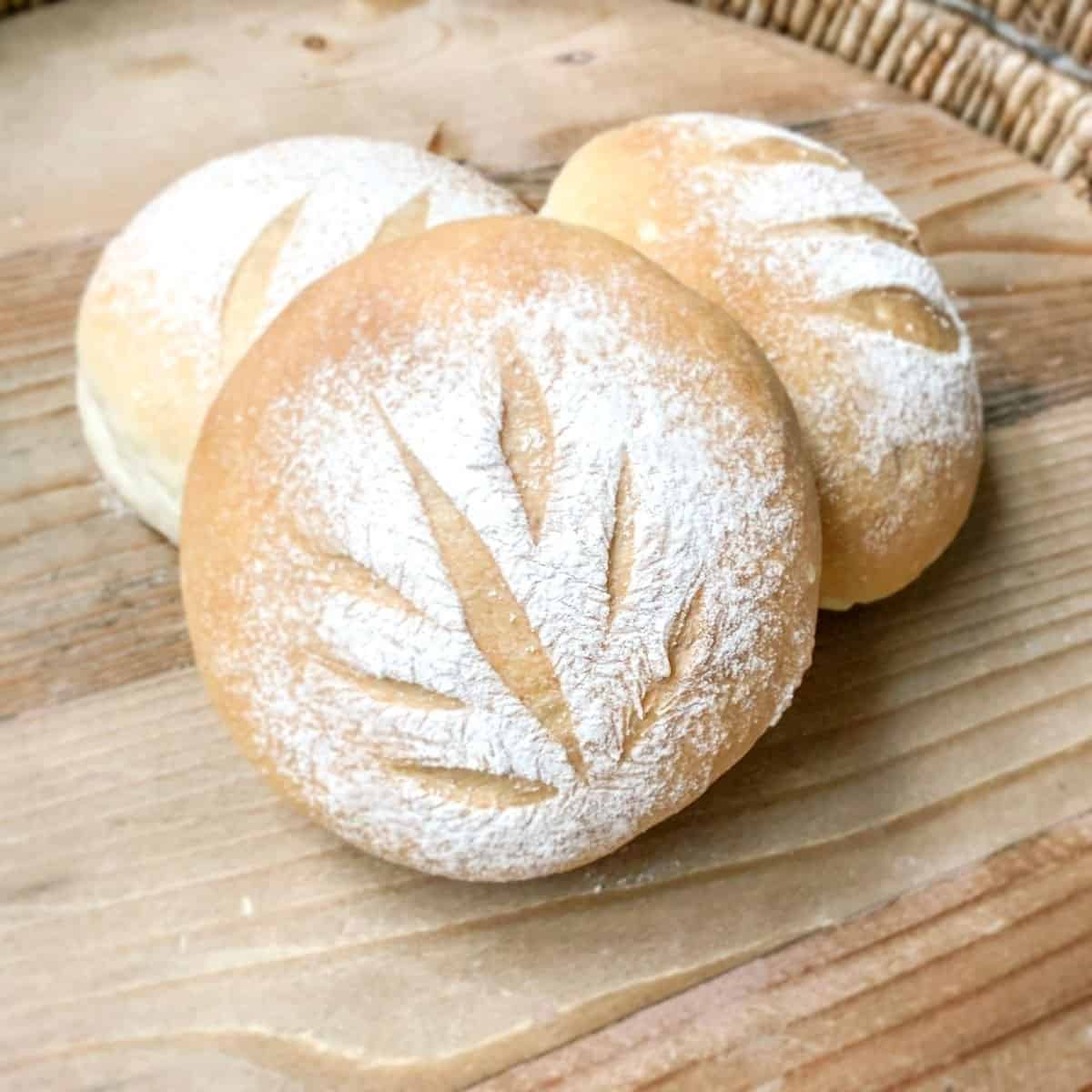 three small round yeast breads